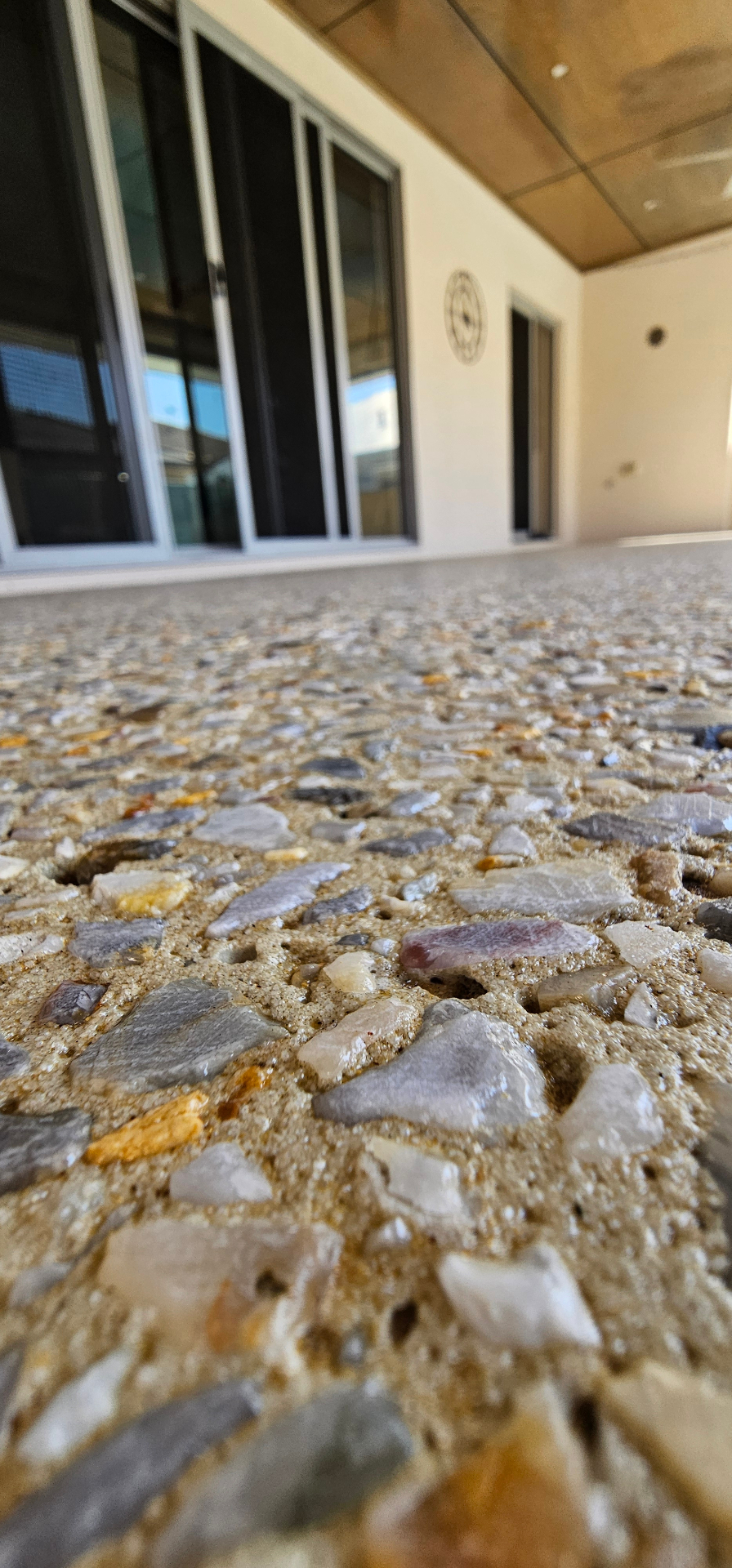 Honed washed aggregate finish