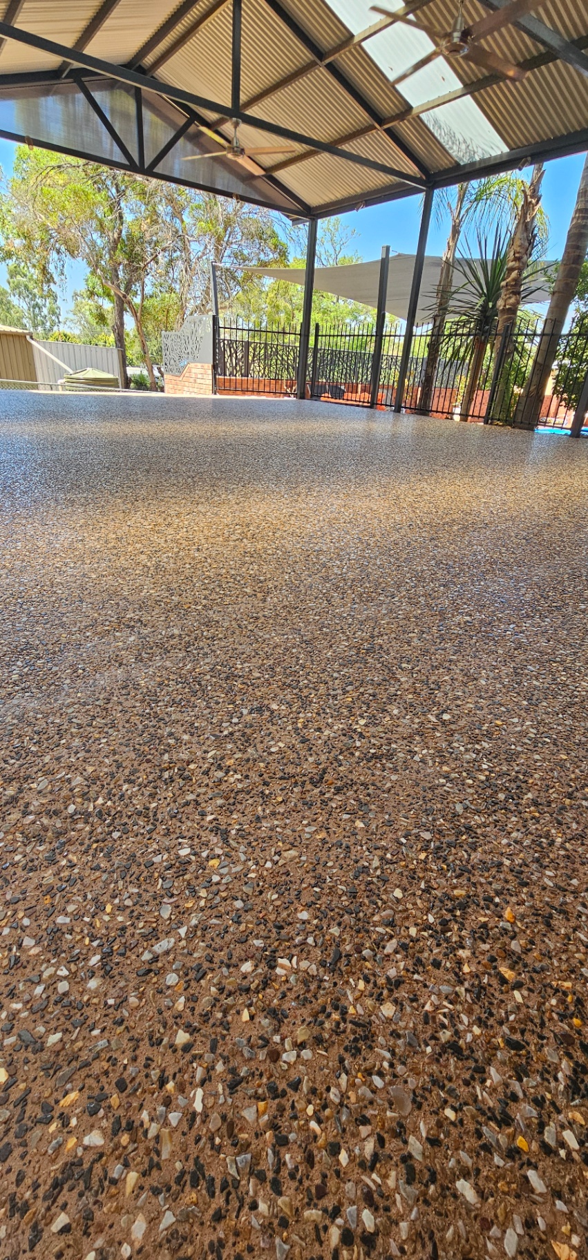 Honed washed aggregate finish