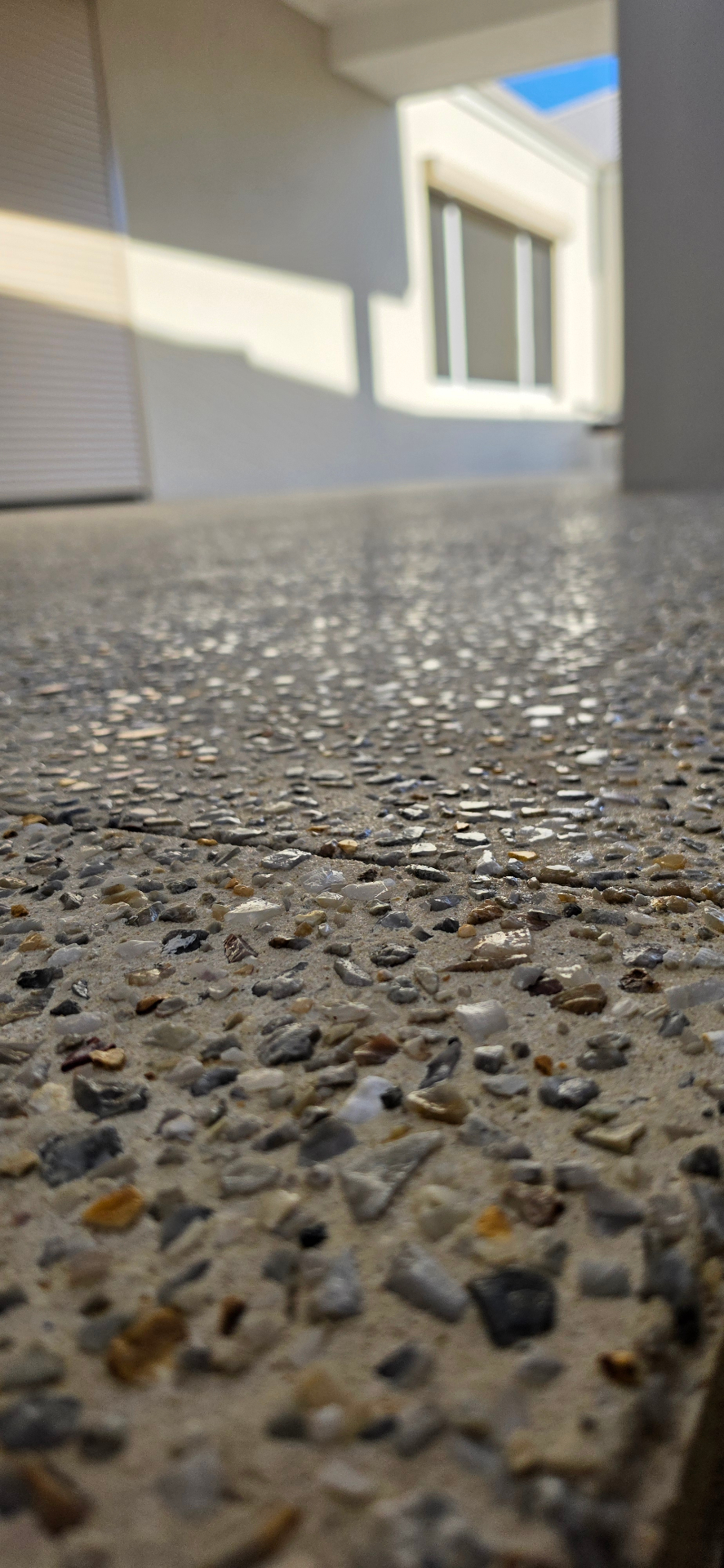 Honed washed aggregate finish