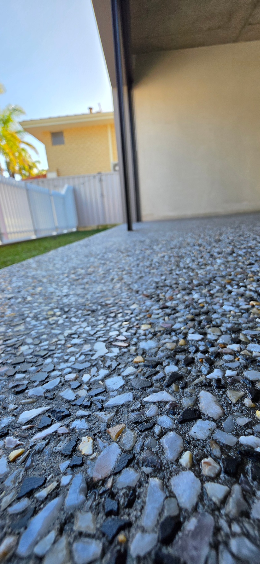 Honed washed aggregate finish