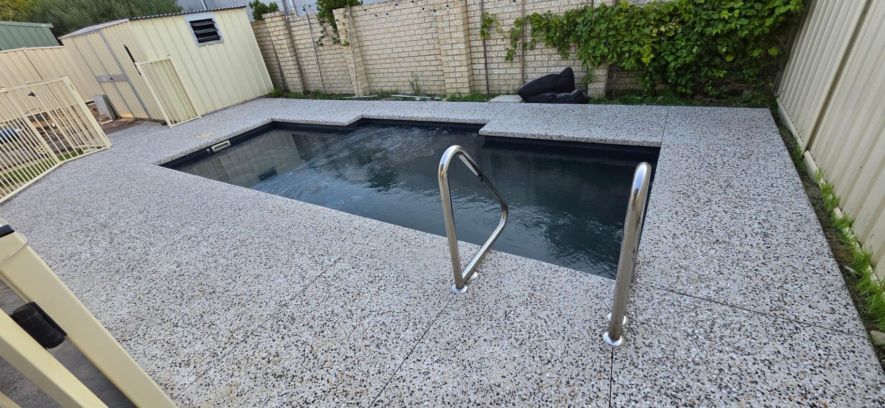 Honed washed aggregate finish
