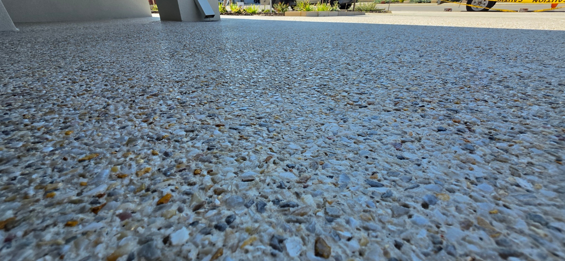 Honed washed aggregate finish