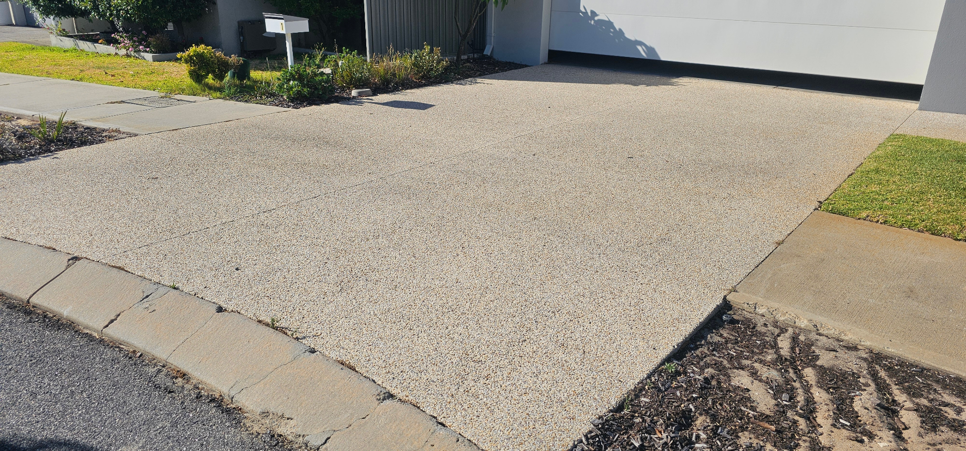 Honed washed aggregate finish